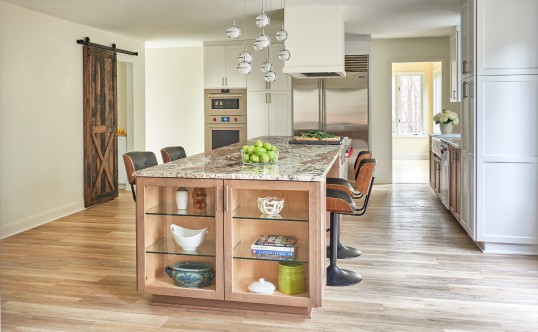 Modern Kitchen with granite island, barstools and wood floors