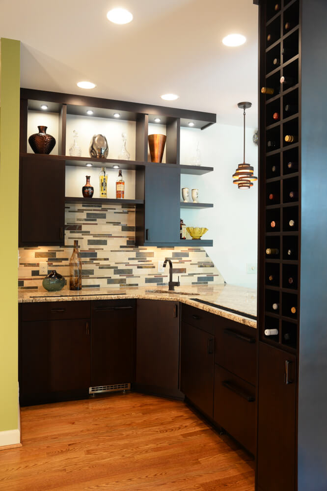 after photo of a kitchen remodel with modern backsplash and wine rack