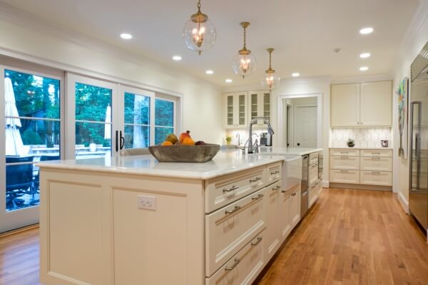 kitchen remodel with island with farm sink and stainless steel dishwasher