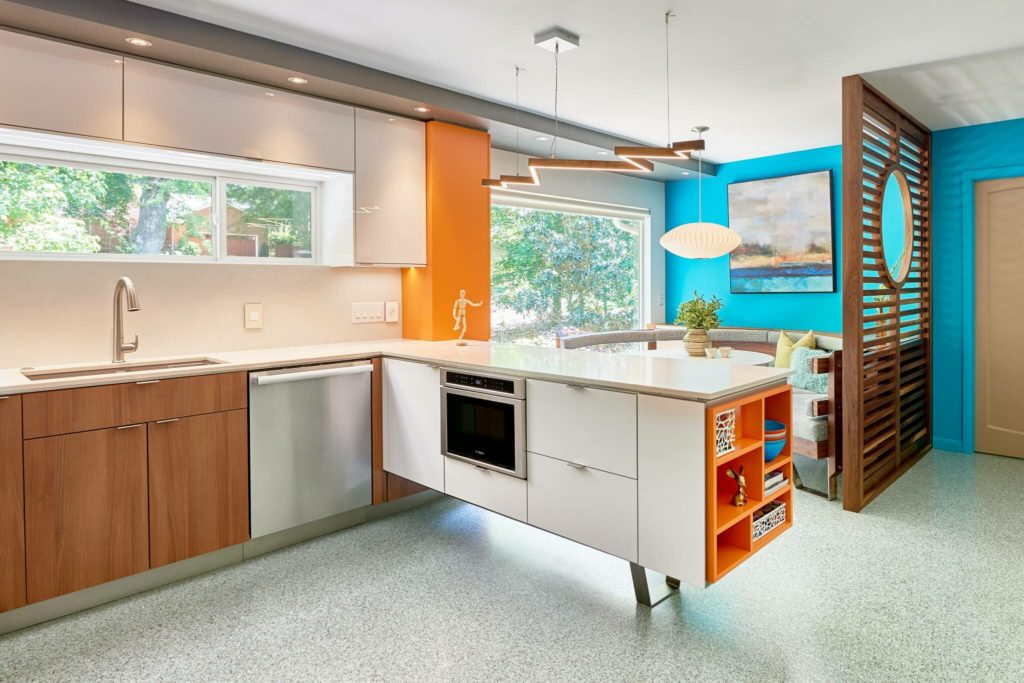Modern and colorful garage in-law suite conversion with corner booth dining area