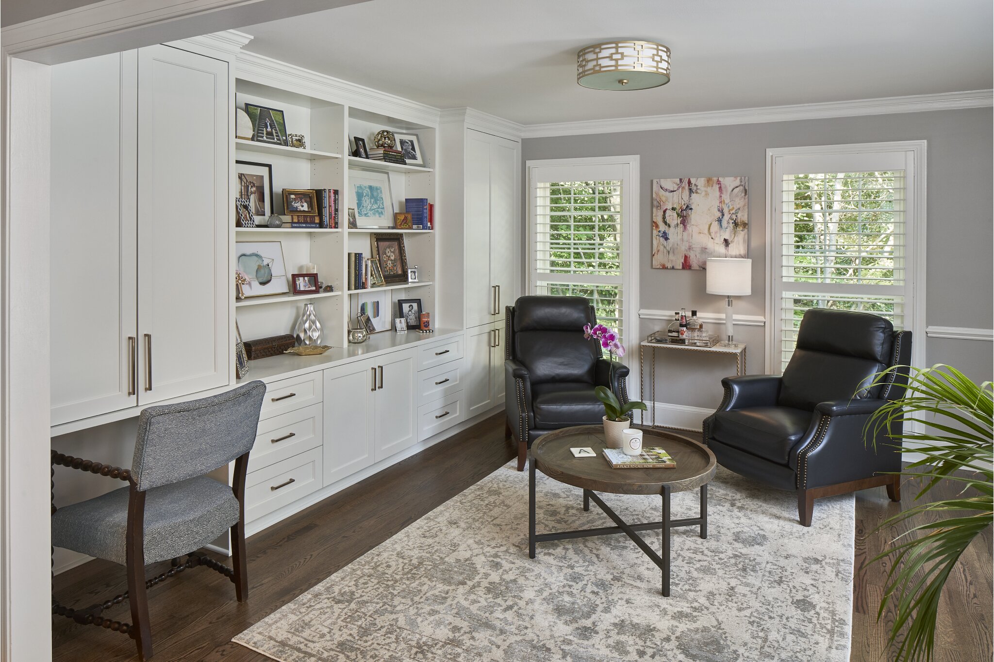 Renovated living room with large white custom cabinet and shelving built-in