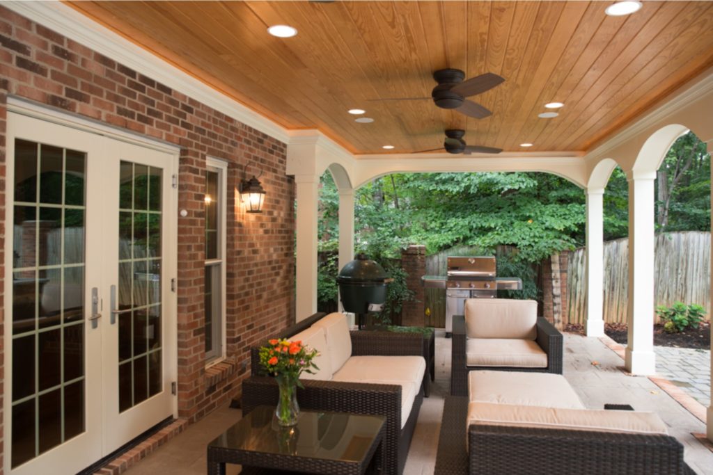 Outdoor patio home addition with recessed lighting and French doors.