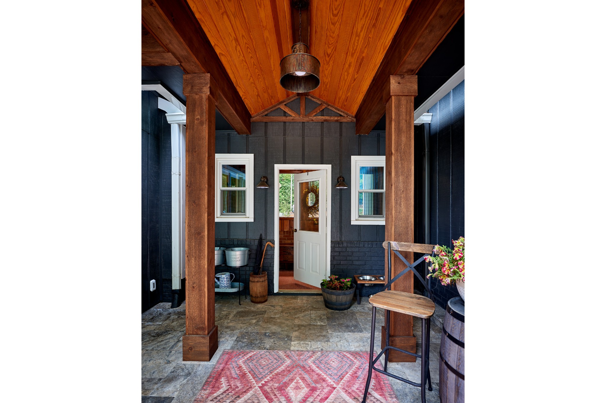 outdoor entryway renovation black vertical paneling wood pergola farmhouse design style