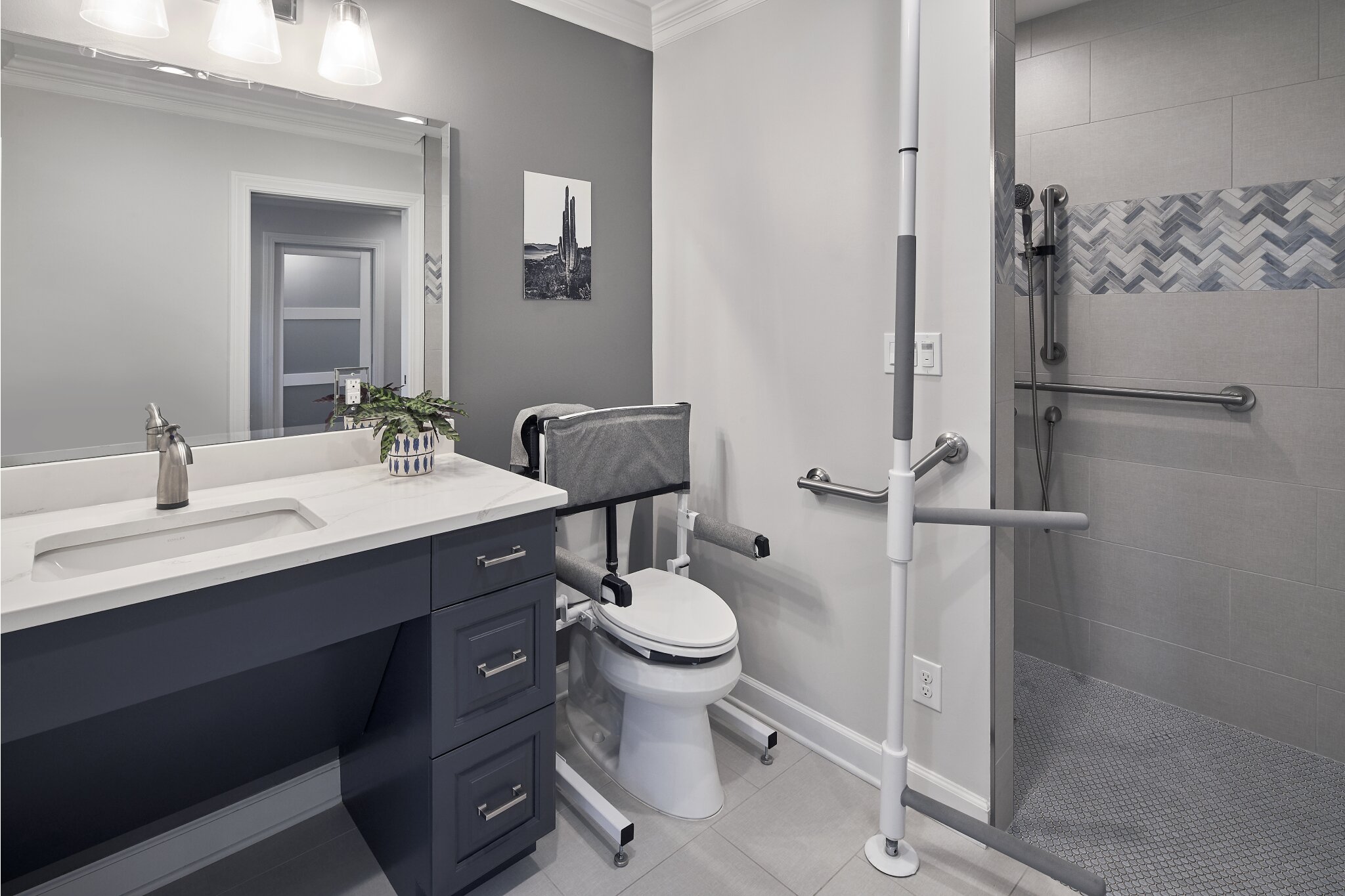 Universal design bathroom renovation with handicap-accessible floating vanity and modified toilet and shower bay