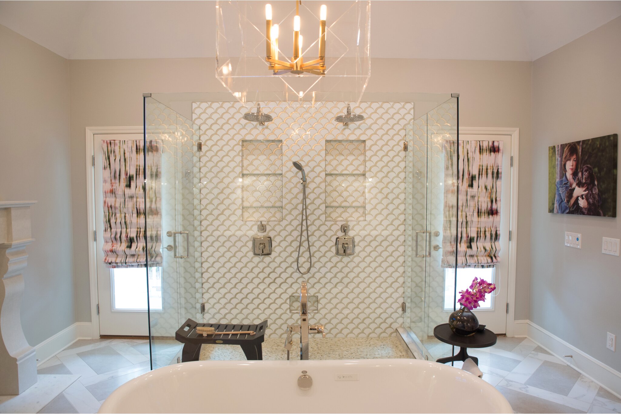 Bathroom remodel with chandelier over soaking tub and a separate large glass shower