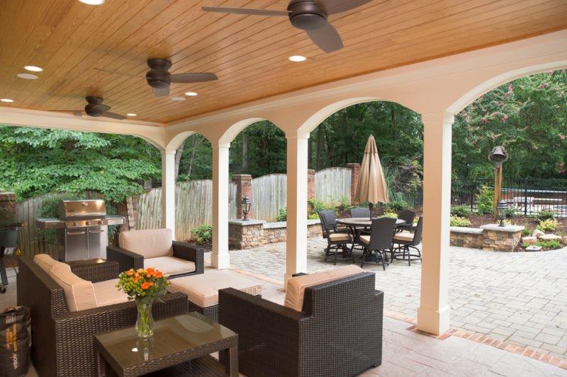outdoor covered patio with patio furniture and a grill