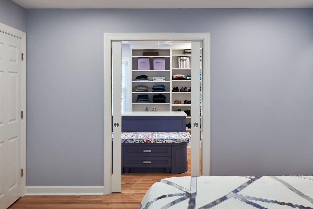 Closet remodel with island and bench in the middle