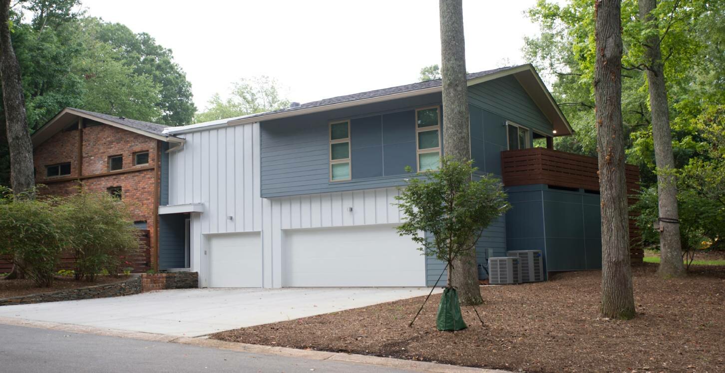 Exterior remodel with white and blue siding