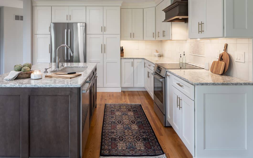 Cozy kitchen remodel with white cabinets and grey wood accents
