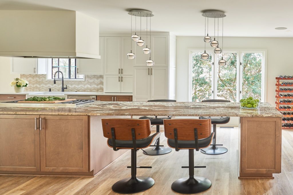 kitchen renovaton long island with stovetop 4 barstools stone coutnertop artistic lighting