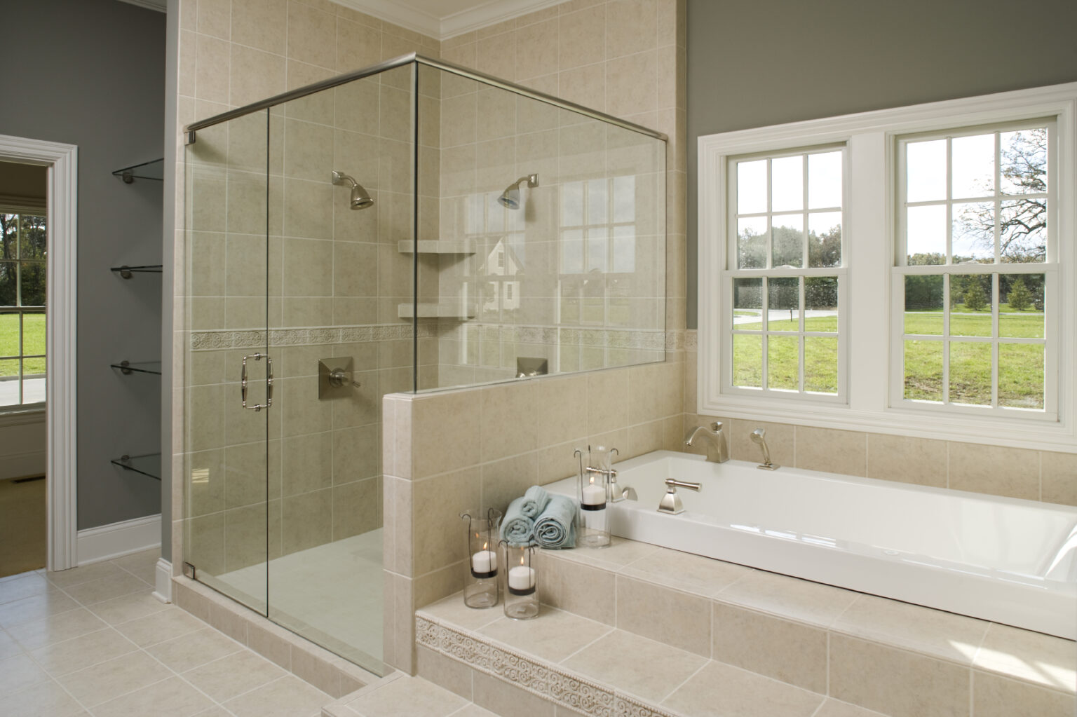 New primary bathroom suite with tiled drop-in tub next to a walk-in shower.